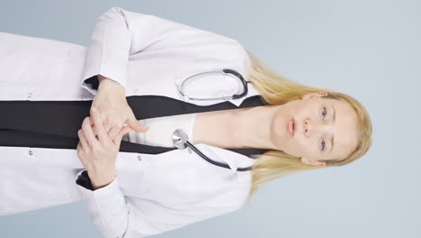 Vertical-video-of-The-doctor-looks-at-the-camera-and-gives-advice.